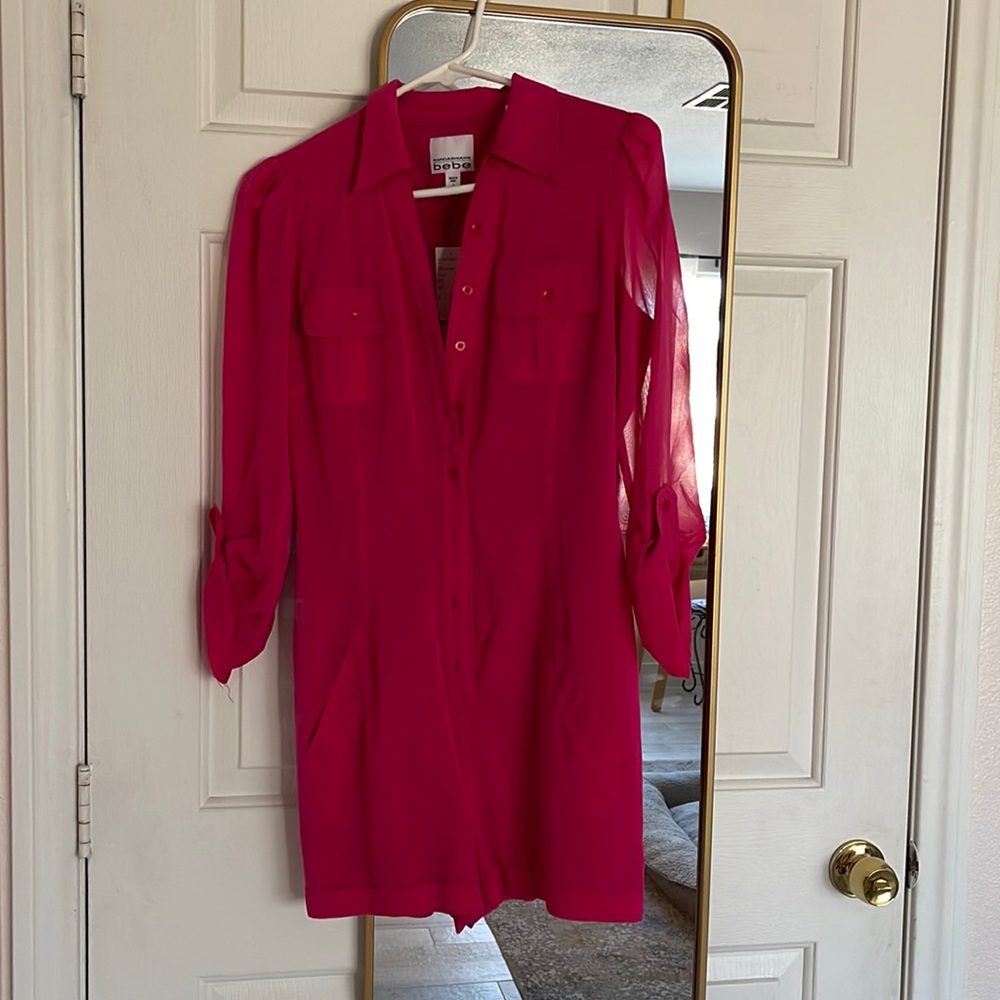 Brand new Kardashian Bebe Fuschia romper in a size Medium. Still has tags.